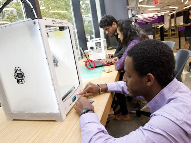 A student using a 3D printer